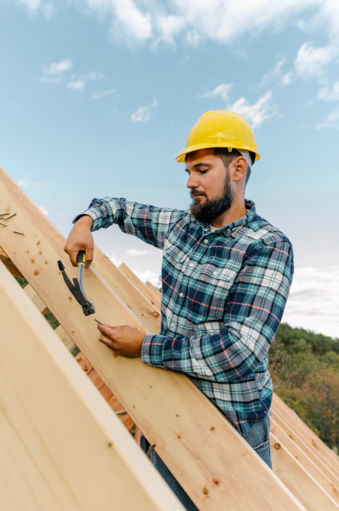 Roof technician on shingles